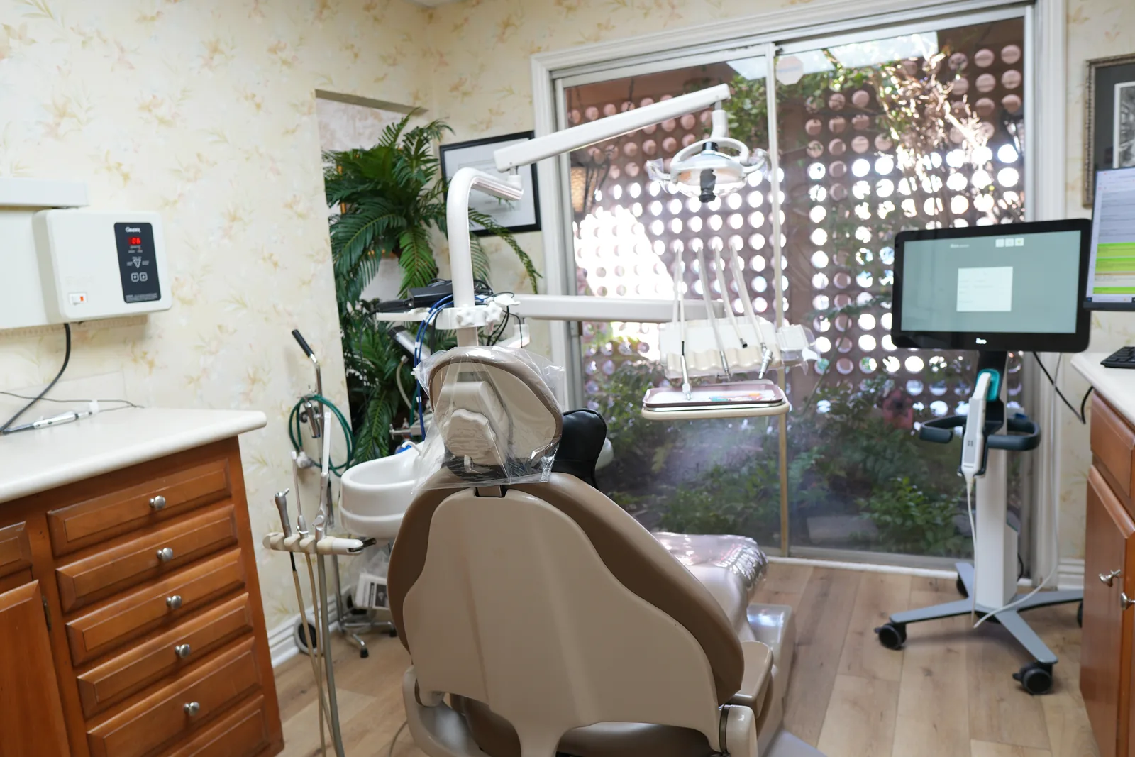 A treatment room with a garden view