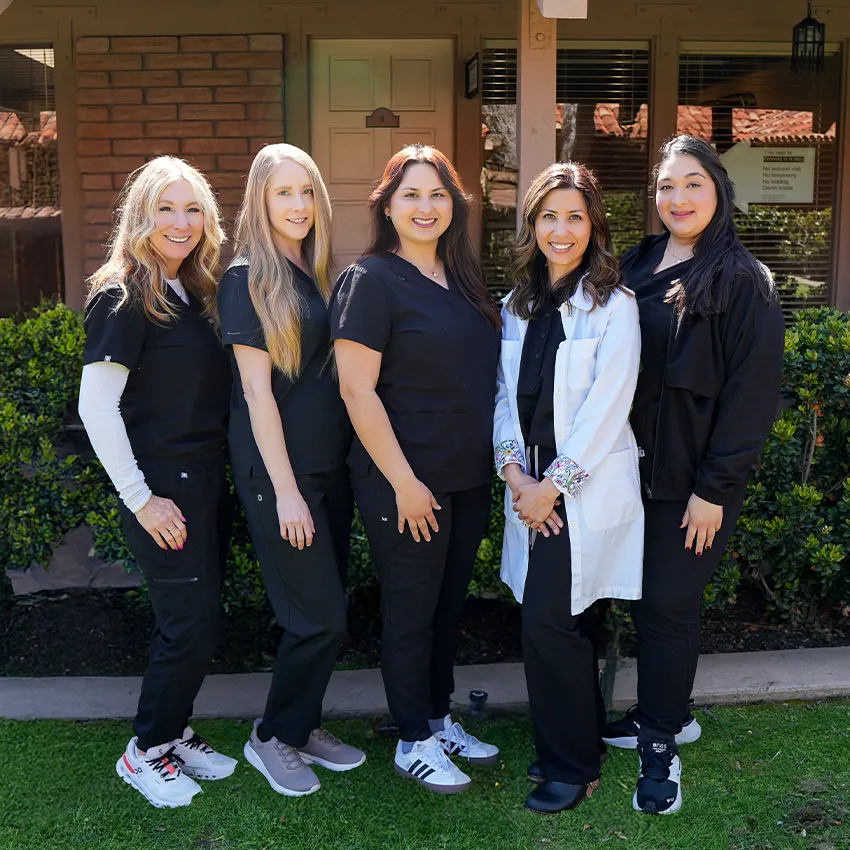The Smile Tustin by Dr. Ezzy team outside the office